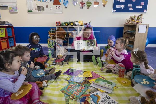 Picture by Peter Frankland. 05-03-26 World Book Day at Little Learners Day Nursery. Kelly Eborall reads to the children at their Teddy Bears Picnic.
