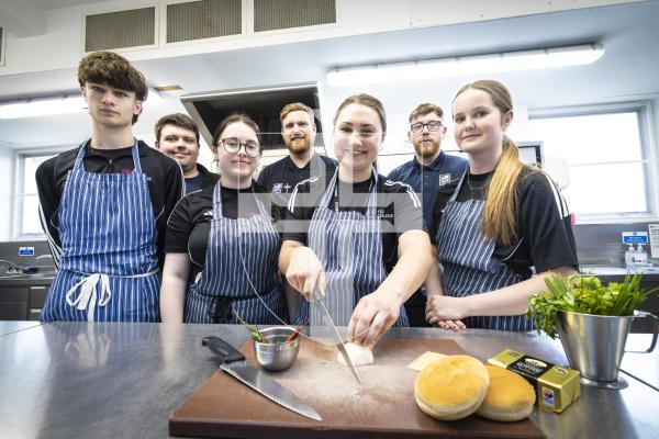 Picture By Peter Frankland. 29-04-26 Royal Navy personnel have been cooking with students at The Guernsey Institute.
L-R - Students - Cameron Maloy, 17, Lily De La Mare, 17, Georgia Peach, 17 and Lexie Fisher, 17. Back - from Royal Navy are Kieran, Matt Palmer and Ryan Evans.