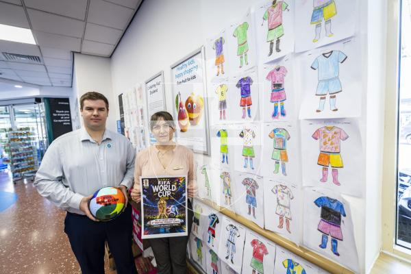 Picture by Sophie Rabey.  03-07-26.   St Martins School students have been drawing football kit designs that are now on display in the St 
Martins Co-Op supermarket.
L-R Adam Brown (Deputy Manager) and Danuta Trzcinska (Store Manager)