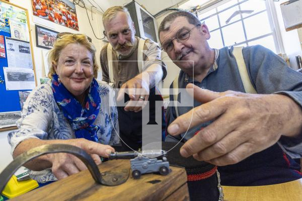 Picture by Peter Frankland. 03-07-26 Teacher Sarah Day has just retired having taught at four different primary schools since 1994. Today she got to fire the Noon Day Gun. Getting a pre-firing lesson from Castle Keepers L-R - Stuart Falla and Shaun Marsh.