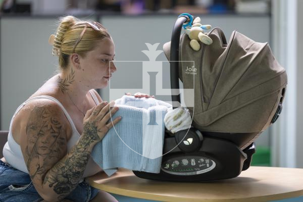 Picture by Peter Frankland. 03-07-26 Alexia Rosamond with her baby, Logan. Miss Rosamond had claimed than her baby was mistreated by a waiter at Driftwood Inn which left Logan with red marks and a cut. She has reported the incident to the police.