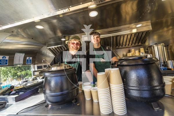 Picture by Sophie Rabey.  06-07-26.  Lé Viaër Marchi 2026 (run by The National Trust of Guernsey) at Saumarez Park.  
Mini Mint providing Bean Jar.  L-R Przemek Korek and Mason Arnold.