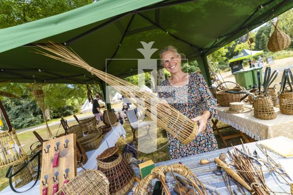 Picture by Sophie Rabey.  06-07-26.  Lé Viaër Marchi 2026 (run by The National Trust of Guernsey) at Saumarez Park.  
Rachael Bearder making a willow wine bottle holder.