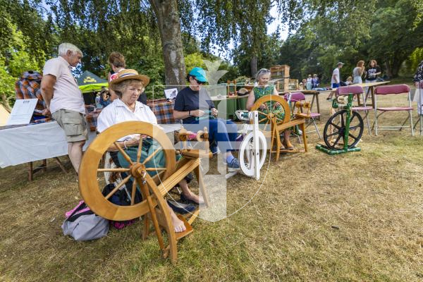Picture by Sophie Rabey.  06-07-26.  Lé Viaër Marchi 2026 (run by The National Trust of Guernsey) at Saumarez Park.  
Spinning yarn L-R Karen Malledent, Ceri Turton and Jane Duchemin.