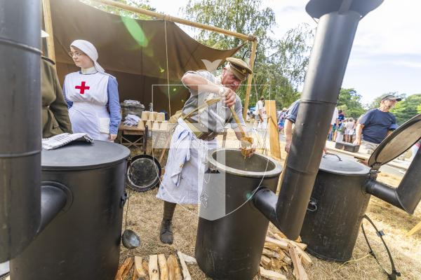 Picture by Sophie Rabey.  06-07-26.  Lé Viaër Marchi 2026 (run by The National Trust of Guernsey) at Saumarez Park.  
Guernsey Military History Company.  
Russell Doherty, who founded the Guernsey Military History Company, serving up his Bean Jar.