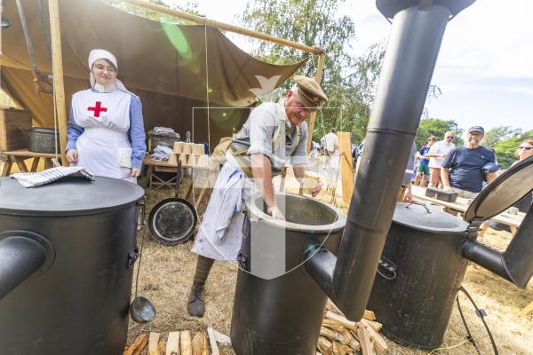 Picture by Sophie Rabey.  06-07-26.  Lé Viaër Marchi 2026 (run by The National Trust of Guernsey) at Saumarez Park.  
Guernsey Military History Company.  
Russell Doherty, who founded the Guernsey Military History Company, serving up his Bean Jar.