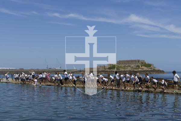 Picture by Christina Jones. 17-07-26 Yr six Vauvert School pupils jump into the water at The Bathing Pools to celebrate finishing their time at the school.