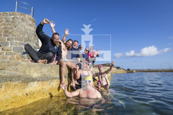 Picture by Peter Frankland. 22-08-26 A group of 10 swimmers have covered 100km in the bathing pools in a swimming relay. L-R - (in water) Mark Bauer, Emma Williamson, Amanda Bowden and John Bauer. Poolside L-R - Chloe McCardel, Guillaume Le Loher, Justin Meades, Terry Wallhead, Mark Ransom and Richard Pearce.