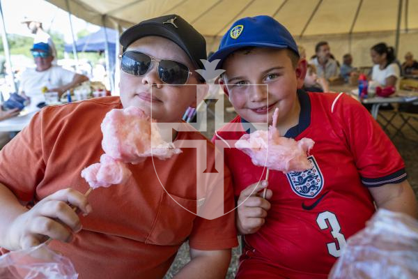 Picture by Peter Frankland. 22-08-26 Lions Club of Guernsey Donkey Derby 2026 at Saumarez Park. Eating candyfloss L-R - Lucas Buxton, 11 and Isaac Buxton, 8. From Doncaster.