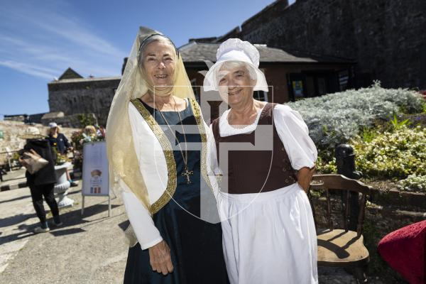 Picture by Peter Frankland. 23-08-26 Castle Cornet Fete d'Etai. L-R - Gerry Alford and Lucy de Carteret were welcoming people into the castle.