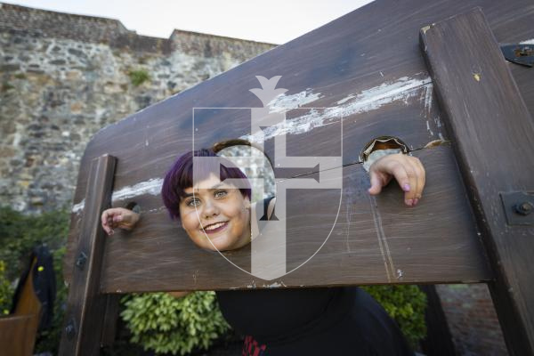 Picture by Peter Frankland. 23-08-26 Castle Cornet Fete d'Etai. Alexa-Jade Duquemin, 13 in the stocks.