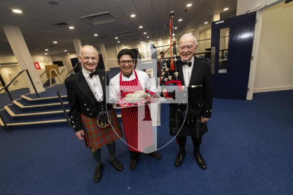 Picture by Sophie Rabey.  31-01-26.  Guernsey's Scottish Association held the Burns Night celebrations at Beau Sejour, sponsored by Titan Wealth.  The Haggis was piped in by Chris Bradshaw (piper) and carried by Mikee Bataller (chef).
L-R Stuart Hardie (Past President of the GSA), Mikee Bataller (chef) and Chris Bradshaw (piper).