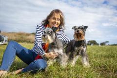 Picture by Luke Le Prevost. 23-09-23.
Schnauzer owners brought their dogs to Pleinmont for the Schnauzerfest charity event to meet up and walk together. Nikki Kennedy-Cook with Lottie (left) and Ruby