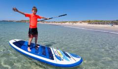 Picture by Karl Dorfner. 29-07-2024 - Hottest Day of the year - Paddle boarder Rory Dorfner (13) getting some sea time at a packed Grand Rocques beach on the hottest day of the year so far