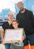 Pic supplied by Andrew Le Poidevin, 14-06-2025. Myles Duquemin organised a protest against the price increases of electricity in Guernsey. Axel De Carteret,7, had designed a poster with the help of his parents Lindsay and Deke.