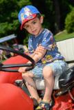 Pic supplied by Andrew Le Poidevin: 15-06-2025.
The 2025 Guernsey Classic Vehicle Club show at Saumarez Park. Even though Reggie Le Cheminant ,3, has plenty opportunity to sit on his fathers tractor he headed straight for the line-up of classic tractors that were on display.