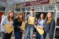Photo by Andrew Le Poidevin, 21-08-2025. The 2025 GCSE Results collection at La Mare De Carteret High School. Grace Sarre, Alex Sarre, Kyle Duncan-Kurz, Lauren Ogier, Gracie Teale.