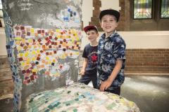 Pic by Adrian Miller 18-07-20 Market square Family Fun Day. L>R Luca Pinsard 4 and Solomon Bearder 7 helped with the mosaic chair
