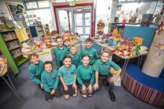 Picture by Sophie Rabey.  20-12-23.  Haute Capelles Primary School have collected donations for local charities as part of this years reverse advent calandar.
The House Captains chose GSPCA, The Sunflower Project, GROW and The Youth Commission, they are pictured alongside their tables of collections.
L-R Back: Solomon Bearder (10), Tabitha Cunningham (11), Ollie Lowe (11), Arden Carre (11).  Front: Oscar Le Flem (10), Chloe Falla (10), Olivia Dyer (10) and Marlee Bienvenu (10).