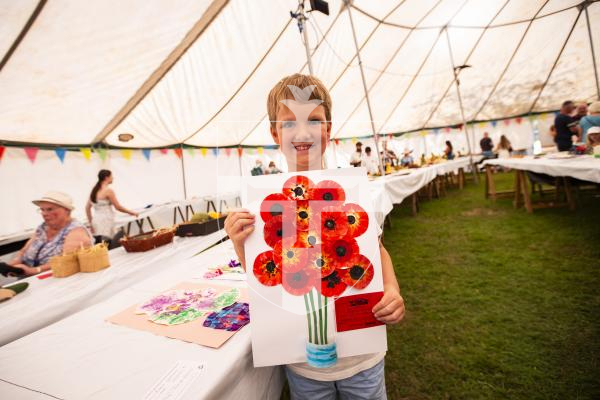 Picture by Sophie Rabey.  23-08-23.  First day of the North Show at Saumarez Park.
Rupert Glencross (aged 7) and his first placed poppy artwork.