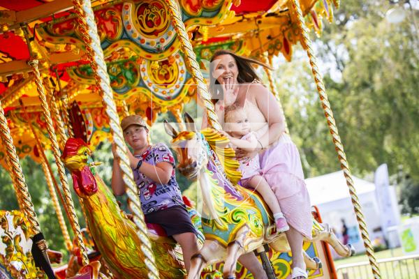 Picture by Sophie Rabey.  23-08-23.  First day of the North Show at Saumarez Park.
Monika Mead with her daughter Natalia (aged 2) enjoying the carousel.