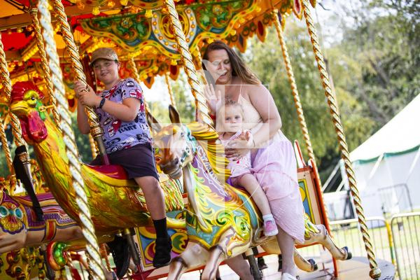 Picture by Sophie Rabey.  23-08-23.  First day of the North Show at Saumarez Park.
Monika Mead with her daughter Natalia (aged 2) enjoying the carousel.