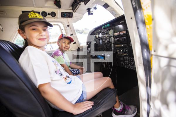 Picture by Sophie Rabey.  23-08-23.  First day of the North Show at Saumarez Park.
Deanna Chapple (aged 8) and Logan Chapple (aged 4) in Joey the plane.