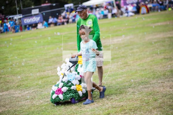Picture by Sophie Rabey.  24-08-23.  North Show 2023, Battle of Flowers.
Class E - Decorated bicycles, any flowers, under 15years of age.
E3 Flower Garden - Lily May Peck
