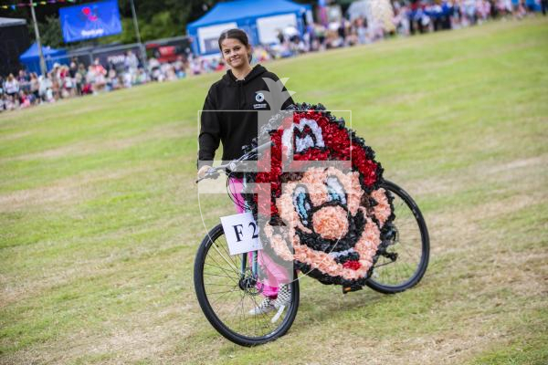 Picture by Sophie Rabey.  24-08-23.  North Show 2023, Battle of Flowers.
Class F - Decorated bicycles, any flowers, any age.
F2 Super Mario - Phoebe Smart