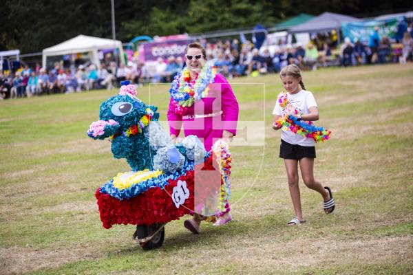 Picture by Sophie Rabey.  24-08-23.  North Show 2023, Battle of Flowers.
Class G - Decorated wheelbarrow, any flowers, adult/child.
G1 Aloha Stitch! - Anna & Ness