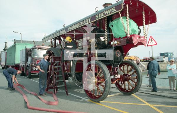 Picture by Guernsey Press.
Nostalgia Lookback feature.
18 Aug 1998. Neg number 2314/03/98.
Firefighter Shane Gaudion fills the water tank of a steam traction engine before it was driven to L'Eree where it would power a showground organ and roundabout at the West Show.