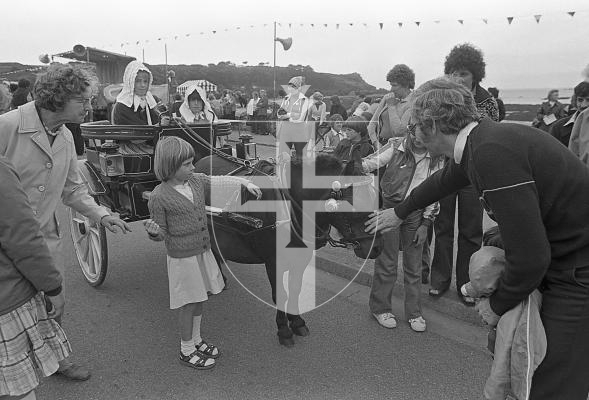 Picture by Guernsey Press.
Nostalgia Lookback feature.
7 Aug 1978. Neg number 2988/78.
A smart turn-out for the Guernsey Driving Society's horse and carriage parade at the Rocquaine Regatta. Two children dressed in traditional costumes completed the "old Guernsey" look.