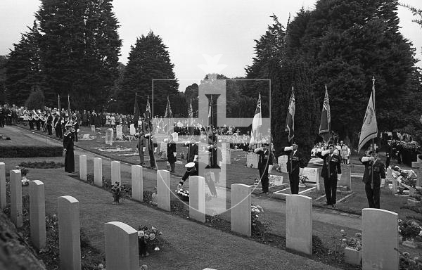 Picture by Guernsey Press.
Nostalgia Lookback feature.
8 Oct 1973. Neg number 4644/73.
Standard bearers of the Royal British legion stand erect before rows of graves which mark the resting places of sailors from the Charybdis and Limbourne during the 30th occasion that the moving scene of remembrance had been enacted.