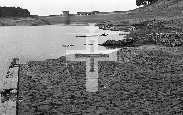 Picture by Guernsey Press.
Nostalgia Lookback feature.
12 Oct 1973. Neg number 4686/73.
Old walls emerge from the water and parched land cracks into a "crazy paving" as water levels fell in St Saviour's reservoir.