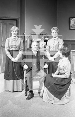 Picture by Guernsey Press.
Nostalgia Lookback feature.
20 Oct 1983. Neg number 2045/5A/83.
GADOC's production of Hobson's Choice. Hobson (Michael Booth) with his three 'uppish' daughters, from the left, Alice (Connie Wakeham), Maggie (Margeret Nicolle) and Vicky (Pat Blampied).
