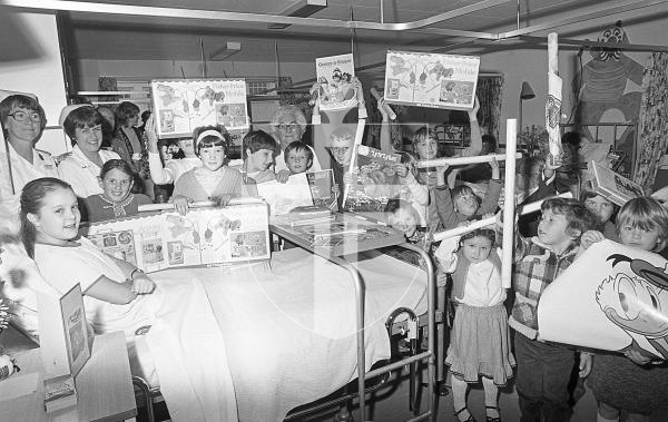Picture by Guernsey Press.
Nostalgia Lookback feature.
26 Oct 1983. Neg number 2078/3/83.
Pupils from La Mare de Carteret Primary School pictured with a range of gifts they presented to the children's ward at the Princess Elizabeth Hospital. The money to purchase the gifts were raised through the school's harvest festival service.