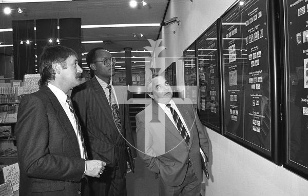 Picture by Guernsey Press.
Nostalgia Lookback feature.
9 Oct 1993. Neg number 3358/2/93.
Philatelic Bureau manager Charles Gardner (left) shows the Smith Street stamp display to Titus Jumas and Colin Freeman from Crown Agents.