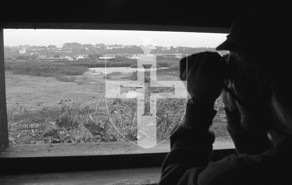 Picture by Guernsey Press.
Nostalgia Lookback feature.
26 Oct 1993. Neg number 3032/13/93.
Bird watching at La Societe Guernesiaise's Claire Mare bird hide in St Peter's.