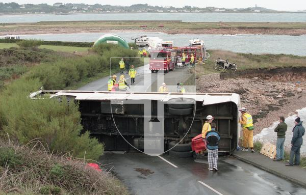 Picture by Guernsey Press.
Nostalgia Lookback feature.
12 Oct 1998. Neg number 2733/1/98.
Organisers of the Albecq crash exercise, simulating a bus packed with partygoers which crashed out of control hitting a car before turning over on its side, went to extraordinary lengths to kake the accident scene as realistic as possible to give members of the Voluntary Ambulance Reserves the on-site, true-to-life training they need.