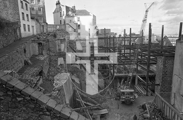Picture by Guernsey Press.
Nostalgia Lookback feature.
20 Dec 1973. Neg number 5614/73.
Looking down on to the South Esplanade office development site. Narrow Coupee Lane (left of the picture), at the rear of the site, is temporarily shored up.