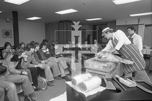 Picture by Guernsey Press.
Nostalgia Lookback feature.
3 Feb 1979. Neg number 295/79.
Mr Dave Allen, chief butcher for Le Riche's Stores, lectured pupils at the College of Further Education in the art of butchering.