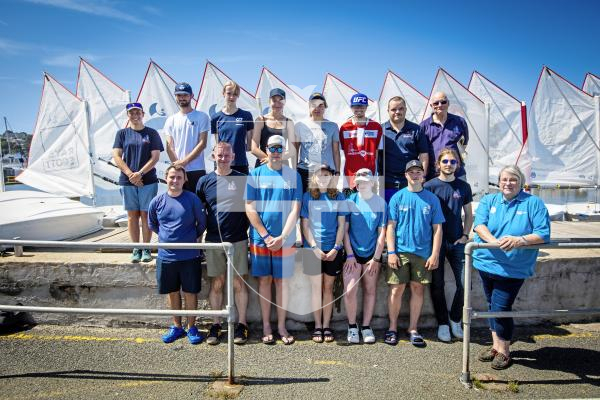 Picture by Peter Frankland. 11-08-24 Association of Sail Training Organisations boats have arrived in St. peter Port ahead of Monday's Royal visit with Sophie, Duchess of Edinburgh. Pictured about to have a go at sailing Optimist dinghys on the model yacht pond are young sailors who are over with the Morning Star Trust on two boats, Eastern Star and Guiding Star. Far right is ASTO Chief Exec Kerry McMillan.