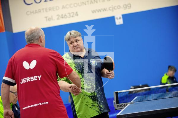 Picture by Peter Frankland. 13-09-24 Table Tennis - Veterans Home Nations 2024 Championships. O60s player Tim Le Page shakes hand with his Jersey opponent.