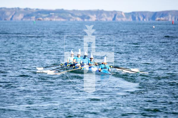 Picture by Karl Dorfner. 14-09-2024 - Pictures from the Belle Greve Bay Rowing race, where some teams raced in fancy dress, featuring a smurf team, super heros, and last years winners dressed as ice cream cones which involved using duvets for the ice cream!