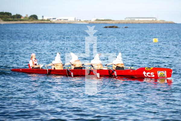 Picture by Karl Dorfner. 14-09-2024 - Pictures from the Belle Greve Bay Rowing race, where some teams raced in fancy dress, featuring a smurf team, super heros, and last years winners dressed as ice cream cones which involved using duvets for the ice cream!