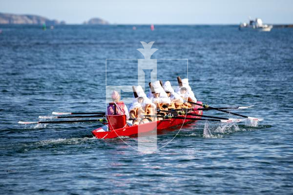 Picture by Karl Dorfner. 14-09-2024 - Pictures from the Belle Greve Bay Rowing race, where some teams raced in fancy dress, featuring a smurf team, super heros, and last years winners dressed as ice cream cones which involved using duvets for the ice cream!