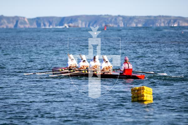 Picture by Karl Dorfner. 14-09-2024 - Pictures from the Belle Greve Bay Rowing race, where some teams raced in fancy dress, featuring a smurf team, super heros, and last years winners dressed as ice cream cones which involved using duvets for the ice cream!