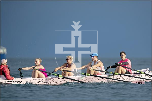 71 Oars4ACause on the finish straight as the sky darkens