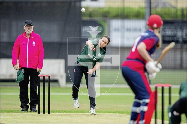 Claire Davies bowling to Analise Merritt