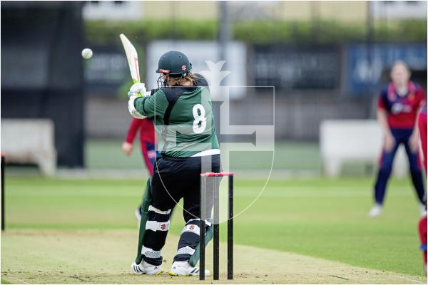 Krista De La Mare pulls to the legside boundary